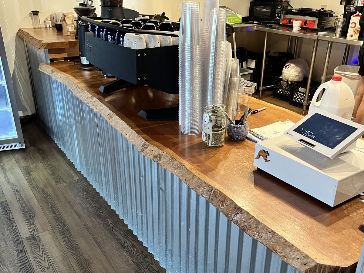 Live-edge service counter in a coffee shop